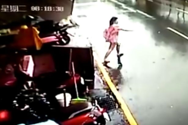 woman-chases-fridge-on-the-street-as-its-swept-away-by-terrifying-typhoon-megi2